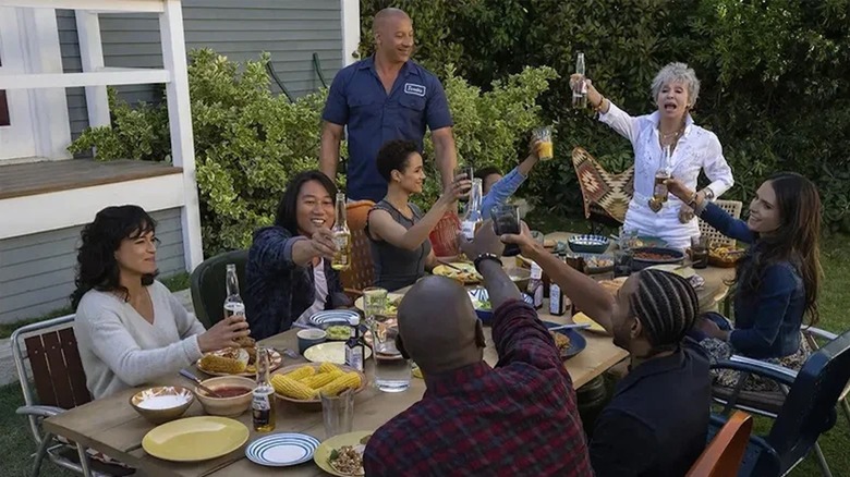 The Fast X family cheersing with Coronas at the table