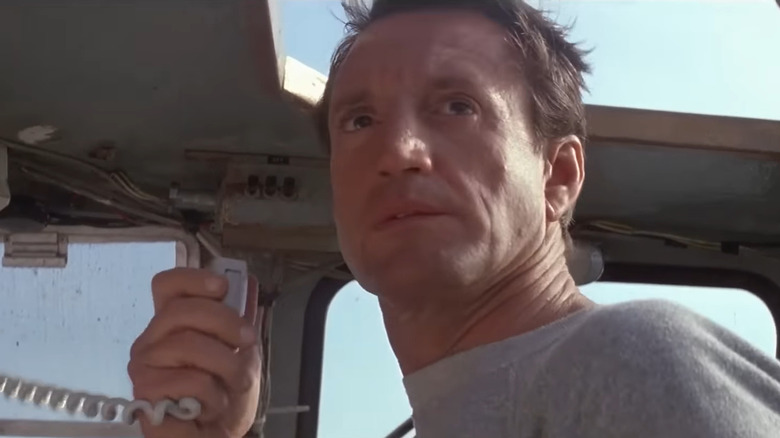 Roy Scheider holding boat radio in Jaws 2