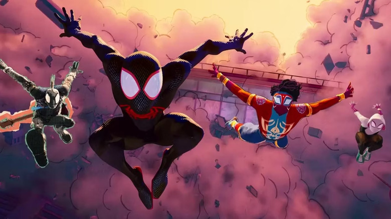 Spider-Punk, Miles Morales, India Spider-Man and Spider-Gwen leap from wreckage in Spider-Man: Across the Spider-Verse