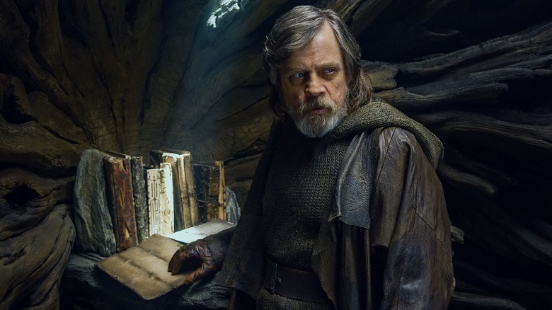 Luke Skywalker opening the sacred Jedi texts in Star Wars: The Last Jedi